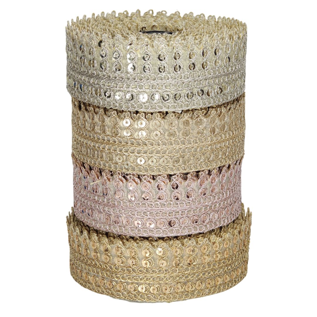 Stack of decorative ribbons with sequins on a white background