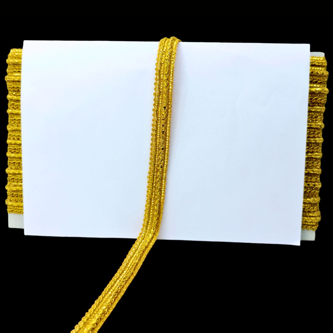 Gold lace trim on a white background