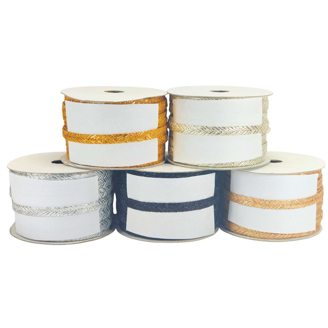 Five spools of ribbon with different color combinations on a white background