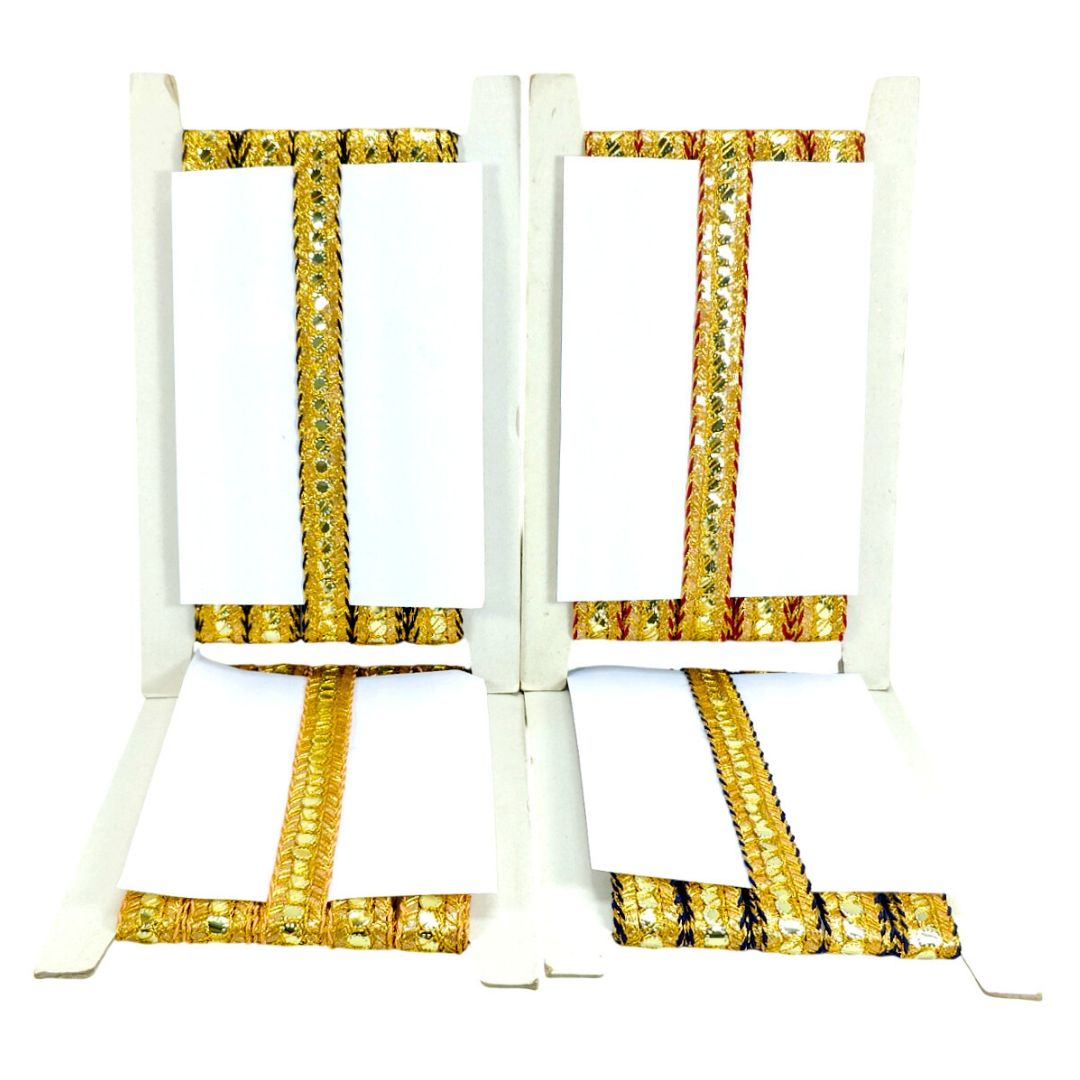 White folding chair with gold decorative patterns on a white background