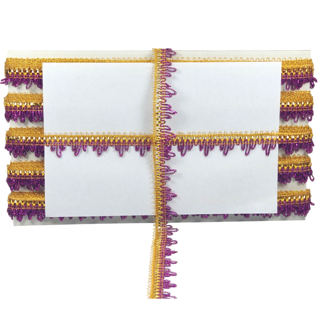 Decorative clutch with gold and purple trim on a white background
