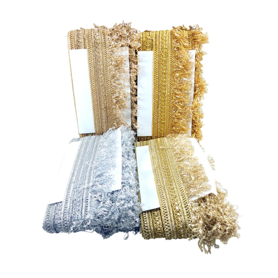 Collection of gold and silver metallic ribbons on a white background