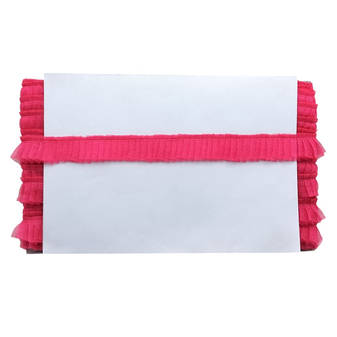 White card with pink ruffled border on a white background