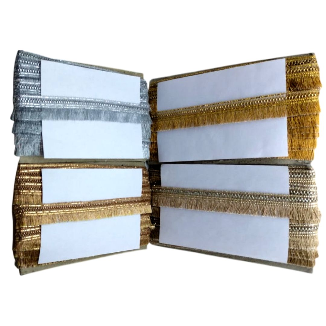 Decorative clutch with gold and silver fringe on a white background