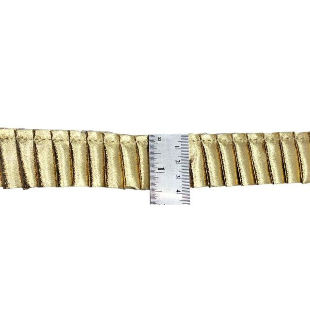 Gold ribbon with a ruler for measurement on a white background