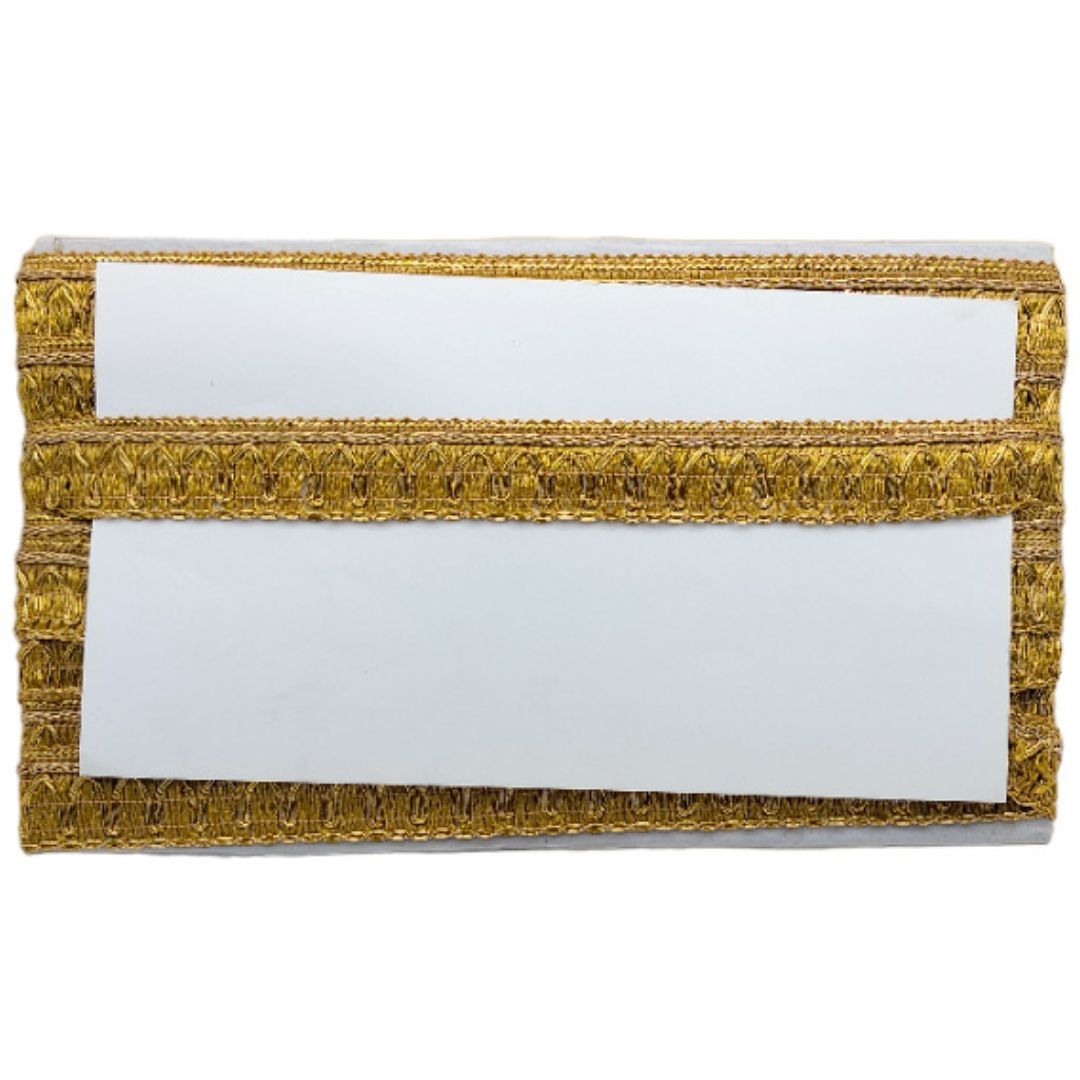 Gold clutch with white interior on a white background