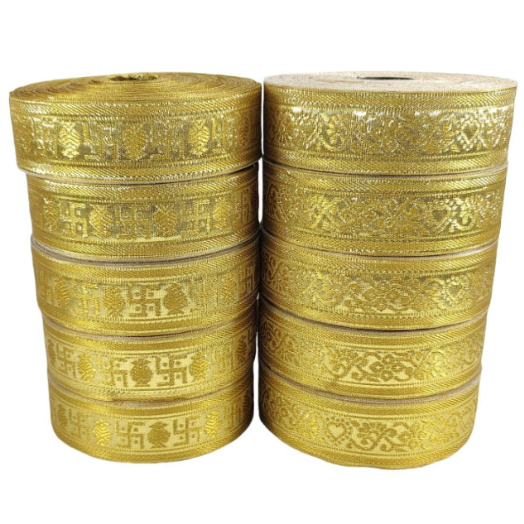 Two stacks of gold ribbons with intricate patterns on a white background