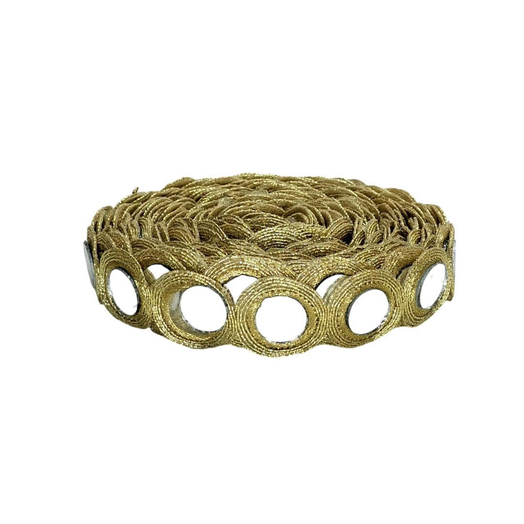 Gold-colored metal mesh roll on a white background