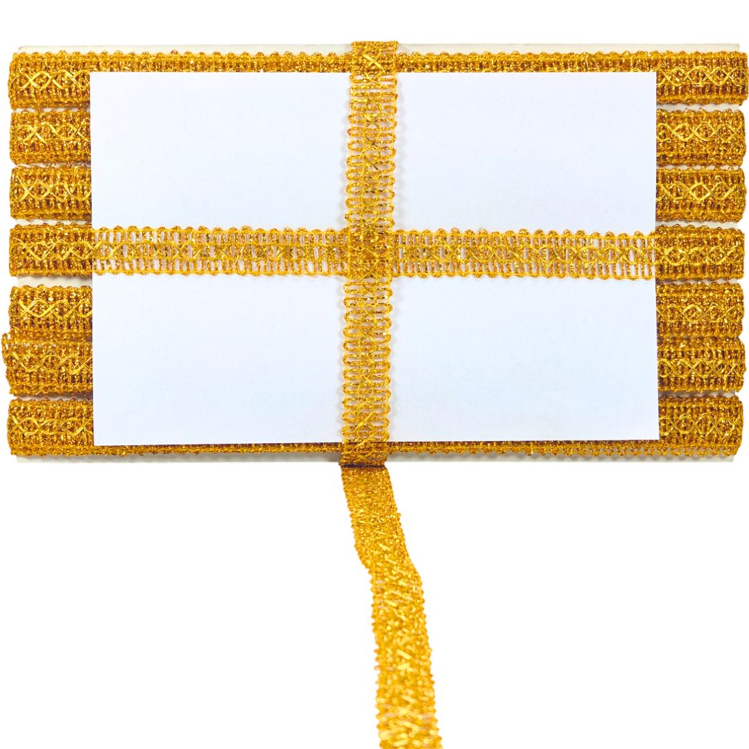 Gold decorative trim with a white center on a white background