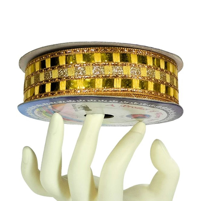 Decorative object with a hand-shaped base and gold circular top on a white background