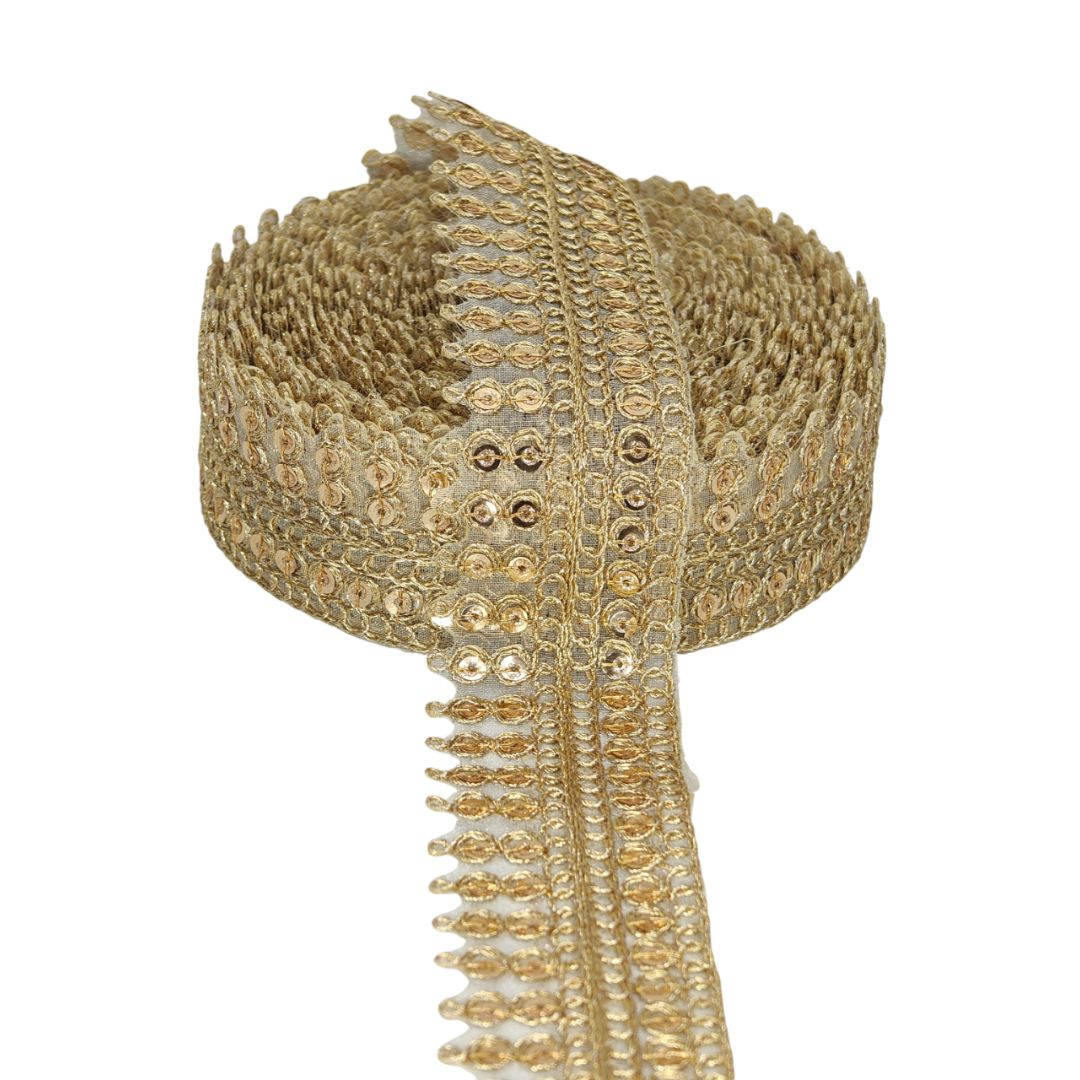 Decorative gold ribbon with intricate patterns on a white background