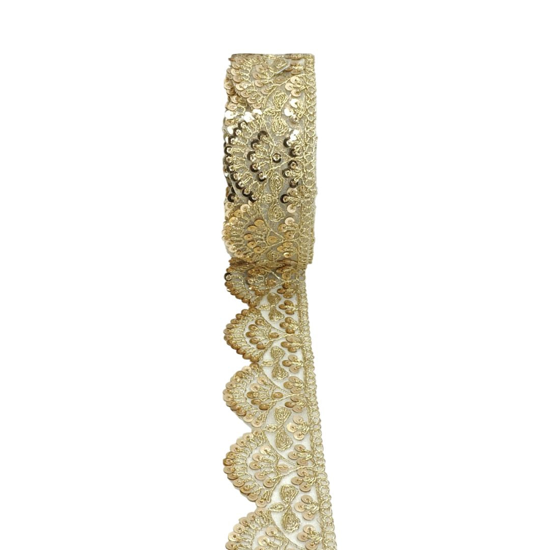 Gold lace ribbon on a white background