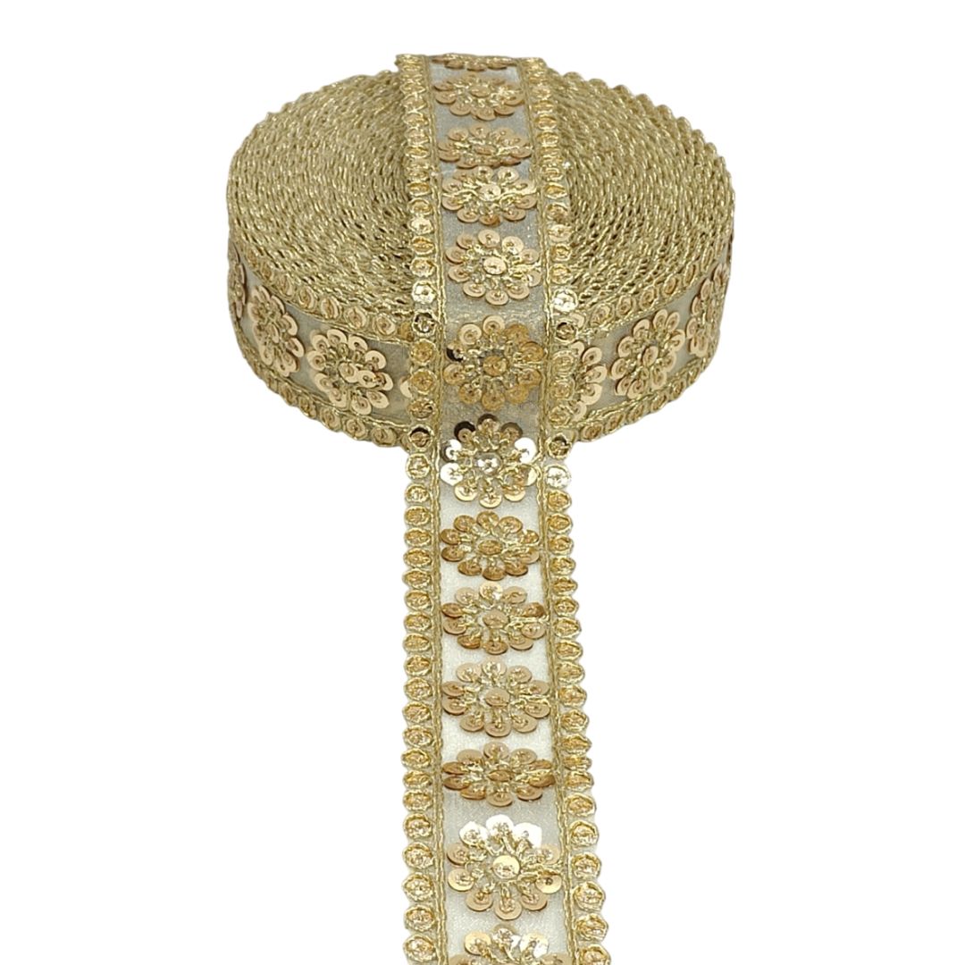 Decorative gold and white ribbon with floral patterns on a white background