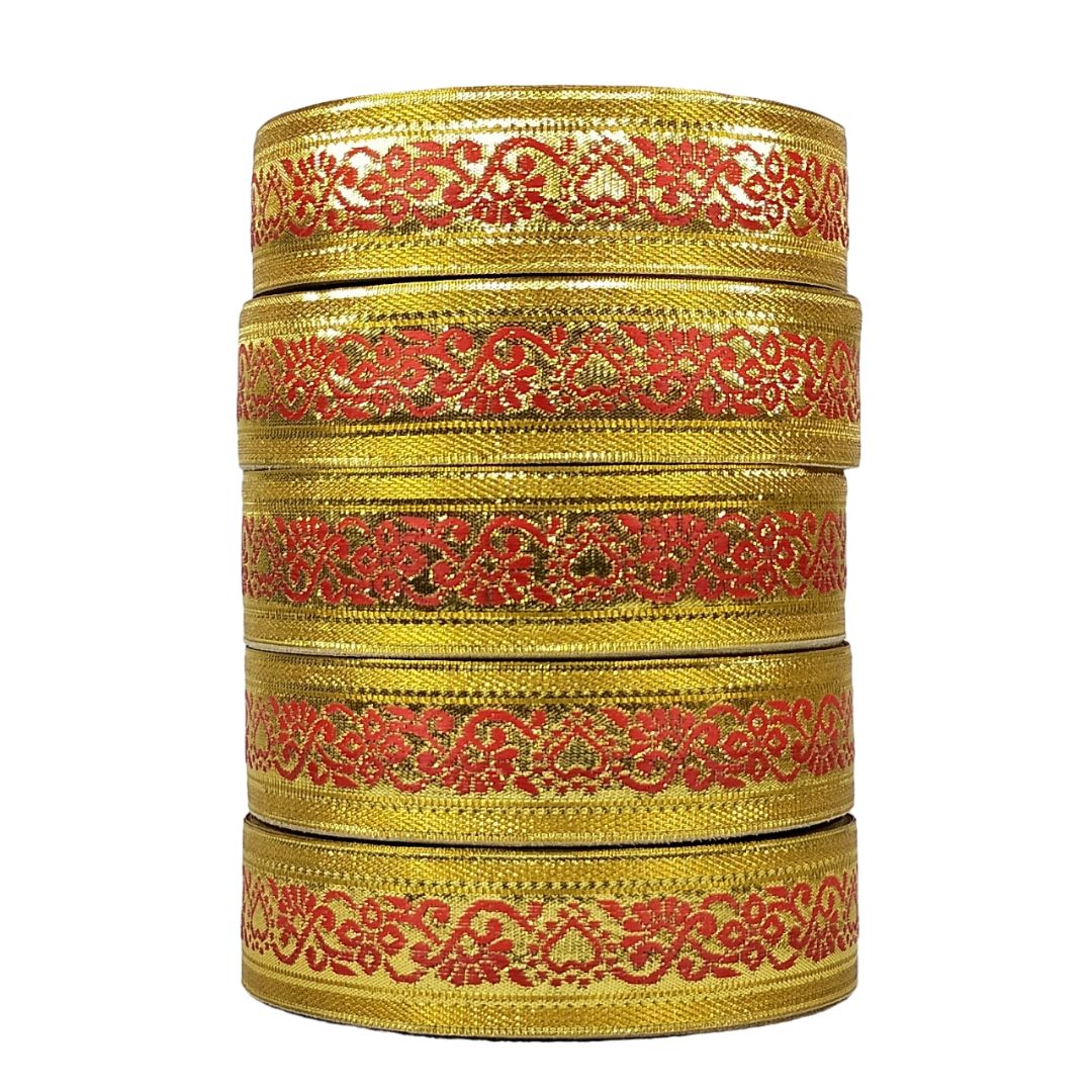 Stack of gold and red decorative ribbons on a white background