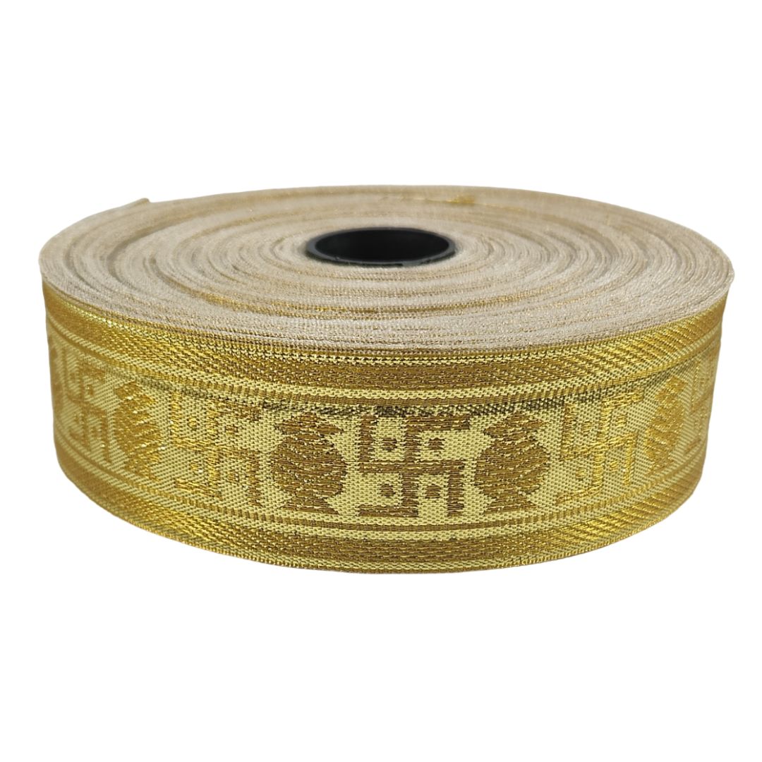 Roll of gold ribbon with a pattern on a white background