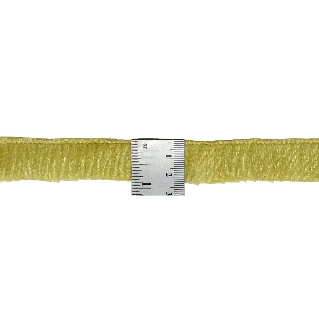 Gold ribbon with a measuring tape on a white background