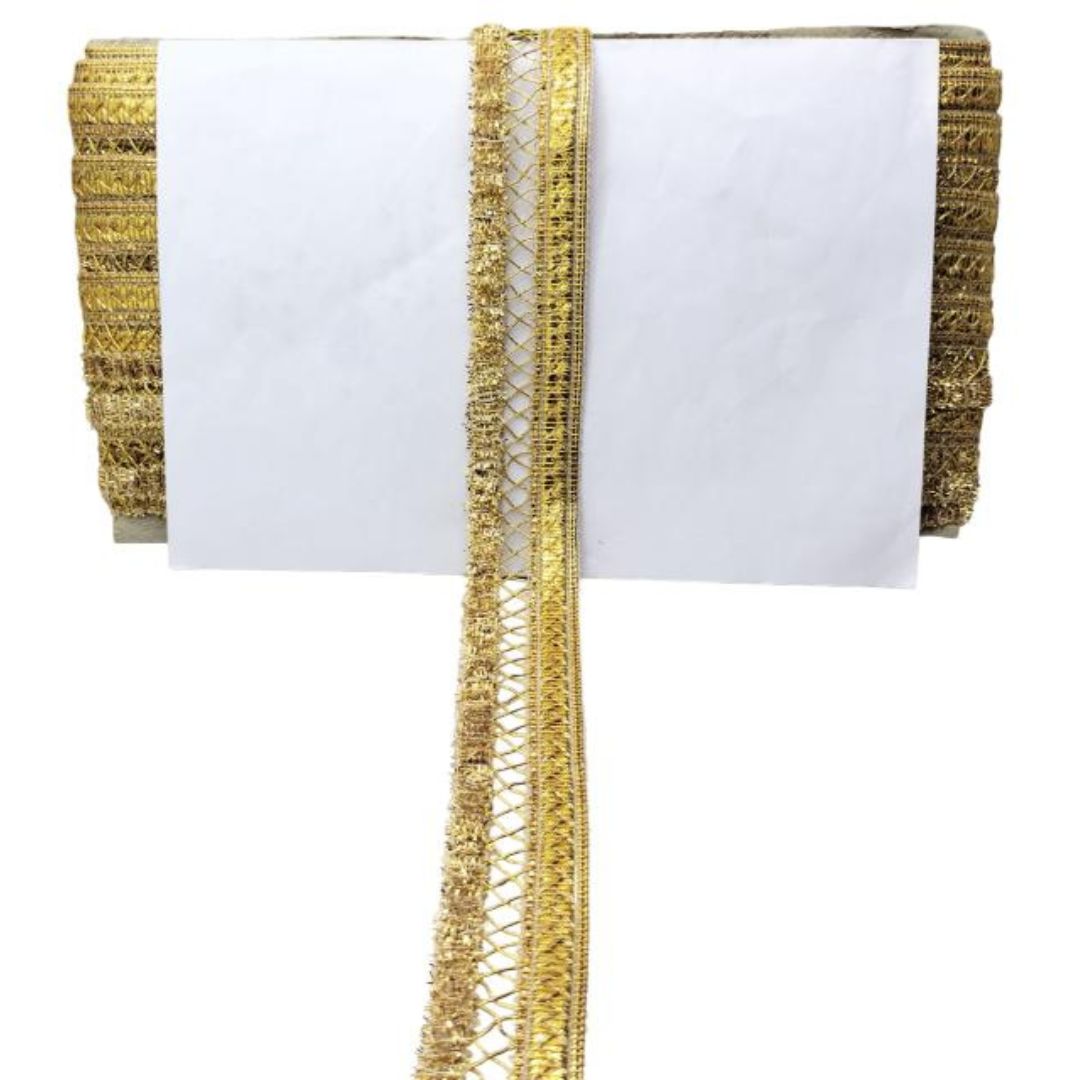 White napkin with gold decorative trim on a white background