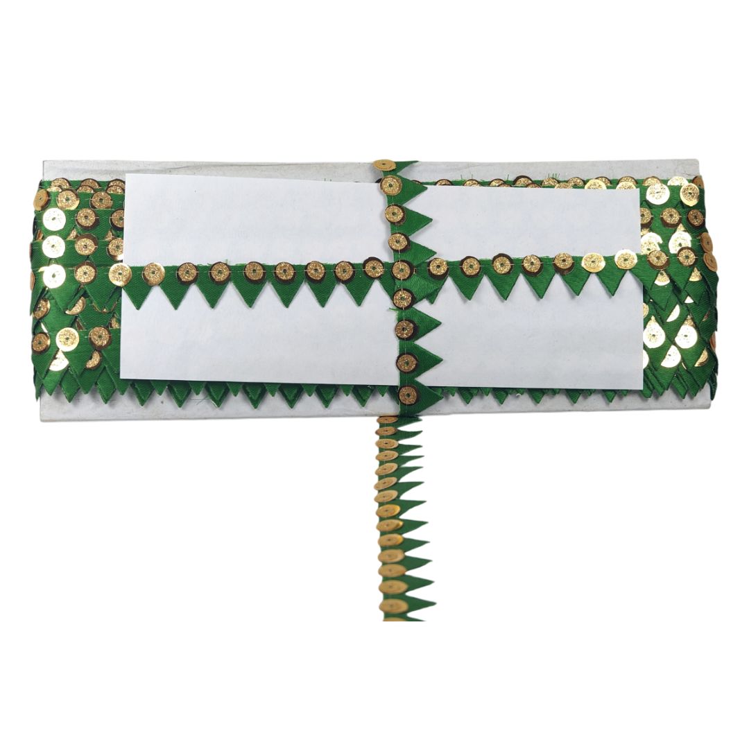 White clutch with green and gold accents on a white background