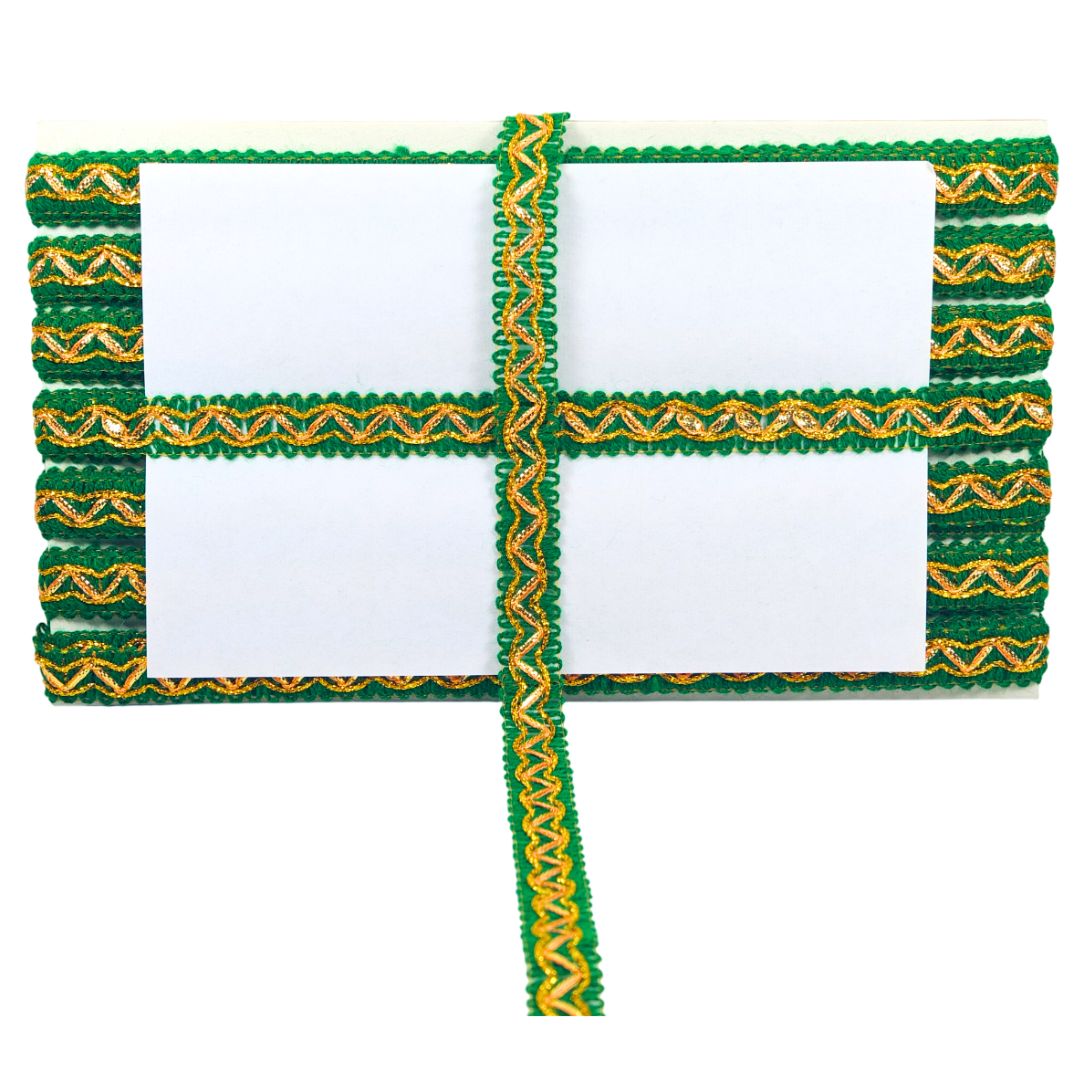 Decorative green and gold ribbon with a white center on a white background