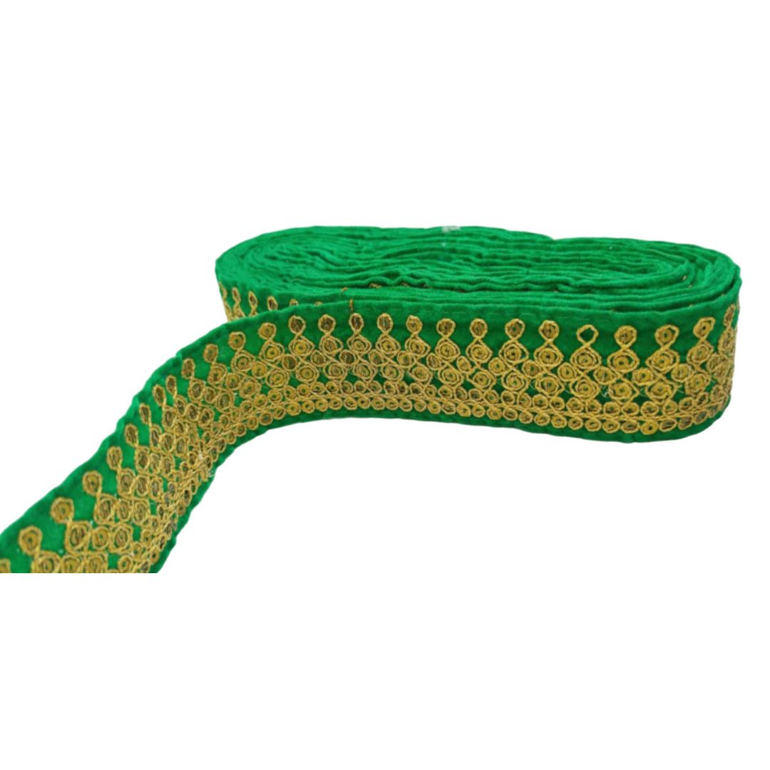 Green ribbon with gold embroidery on a white background
