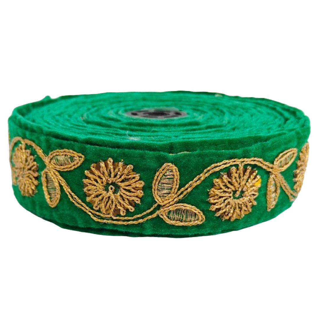 Green ribbon with gold floral embroidery on a white background
