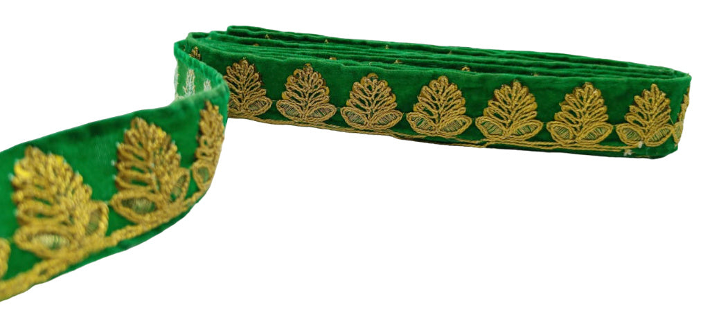 Green ribbon with gold leaf pattern on a white background