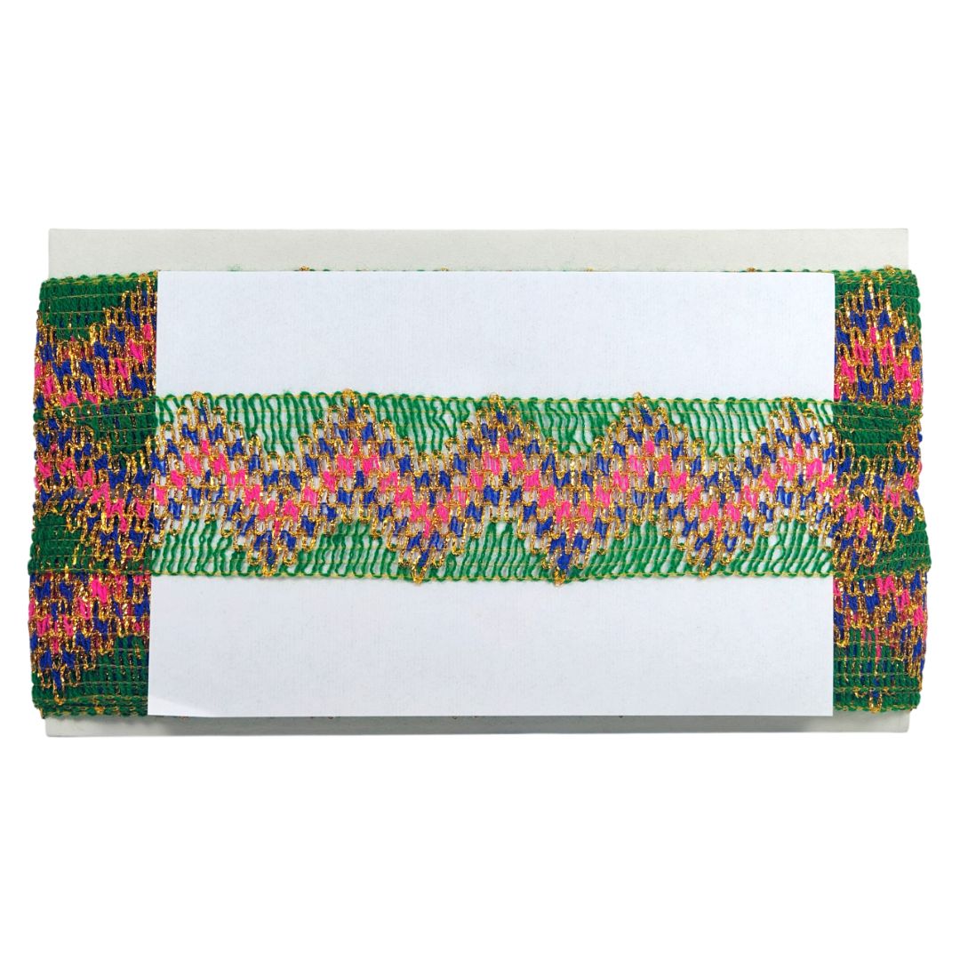 Colorful woven clutch with a white card on a white background