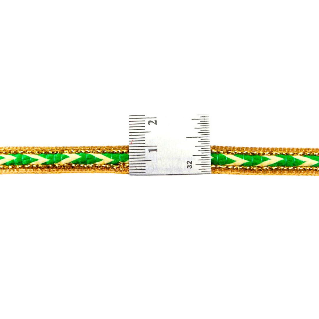 Green and gold braided belt with a ruler for scale on a white background