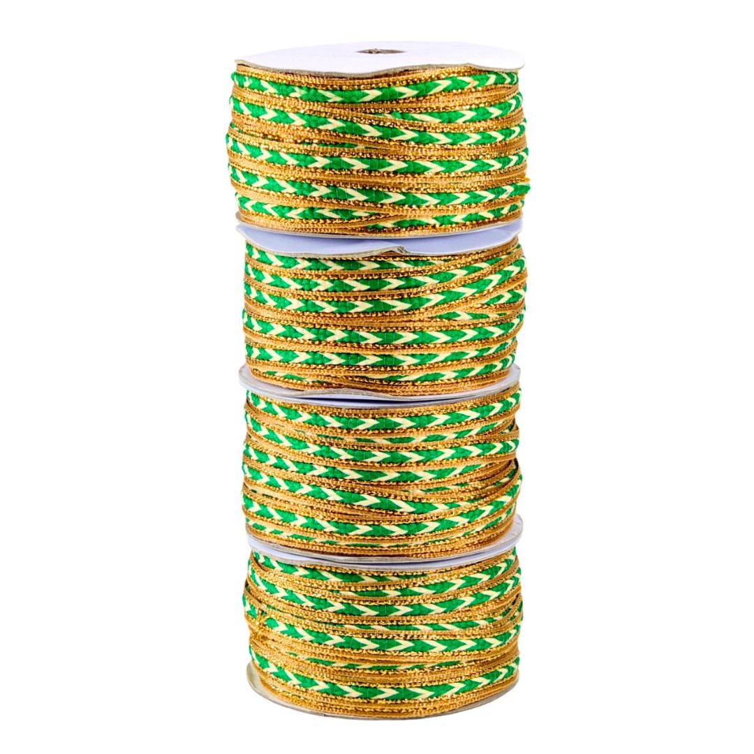 Stack of green and gold bangles on a white background