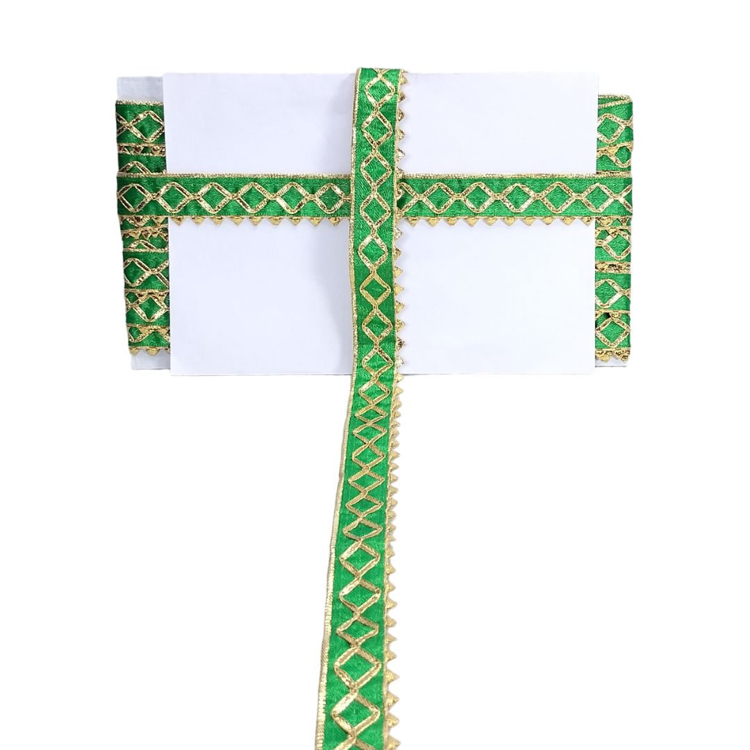 Green and gold embroidered border on a white background
