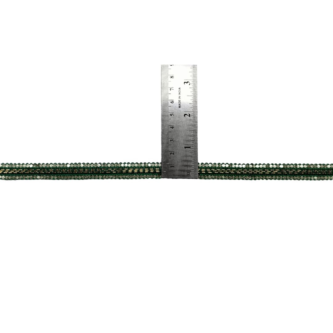 Metallic cable with a ruler showing measurements on a white background