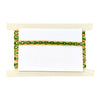 Decorative holder with green and gold pattern on a white background