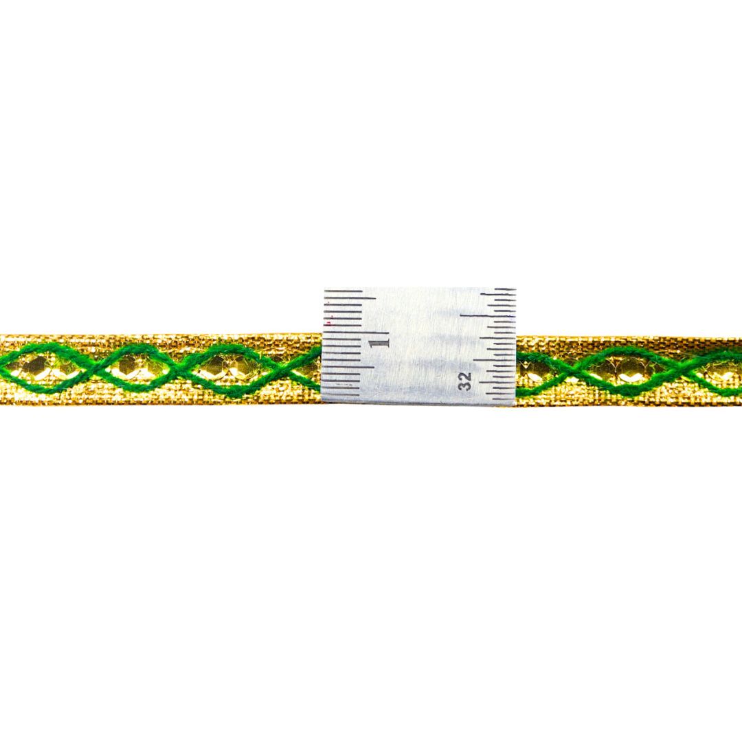 Green and gold braided cord with a ruler for scale on a white background