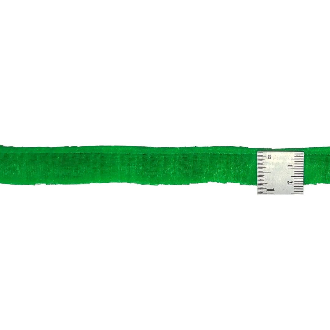 Green belt with a silver measuring tape on a white background