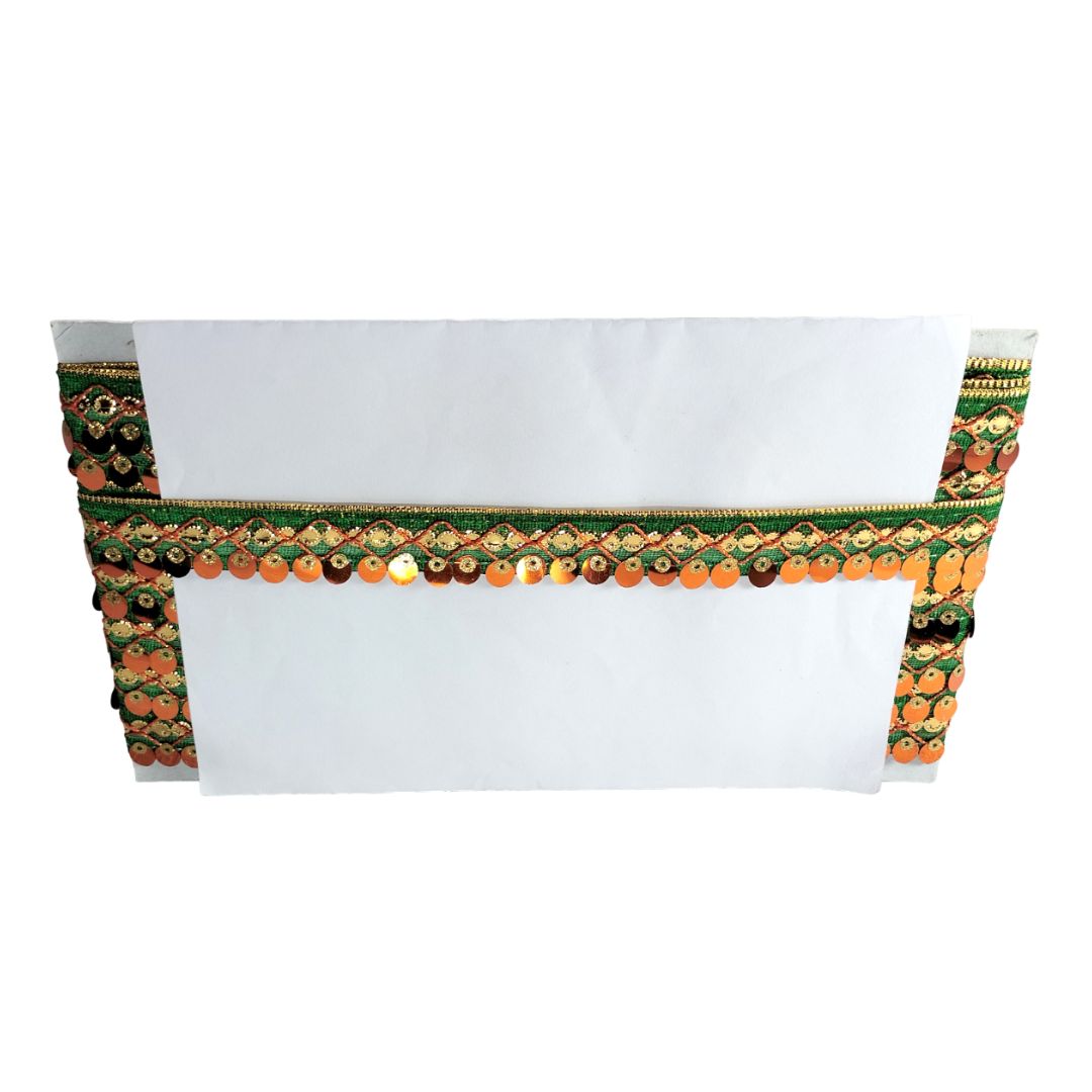 Decorative belt with green and orange patterns on a white background