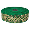 Green ribbon with gold sequin trim on a white background