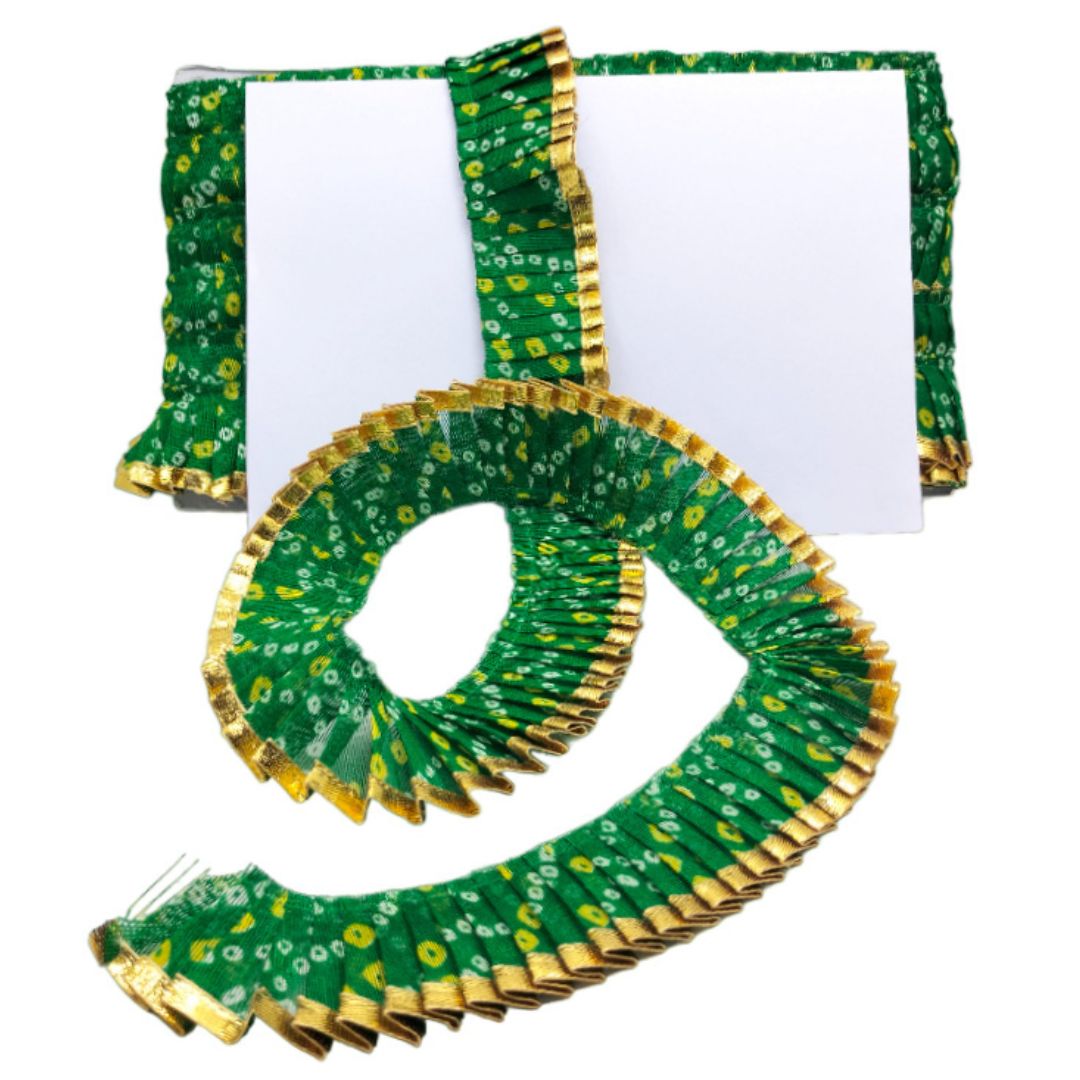 Green and gold decorative item on a white background
