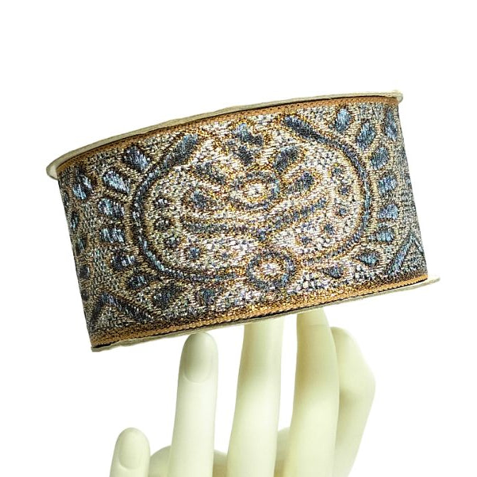 Decorative headband with intricate design on a white background