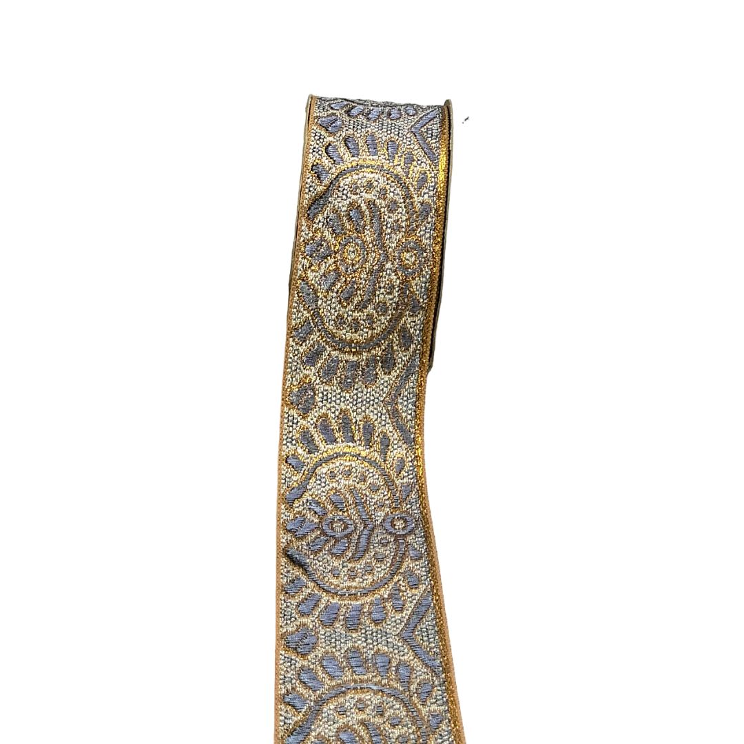 Decorative ribbon with intricate paisley pattern on a white background