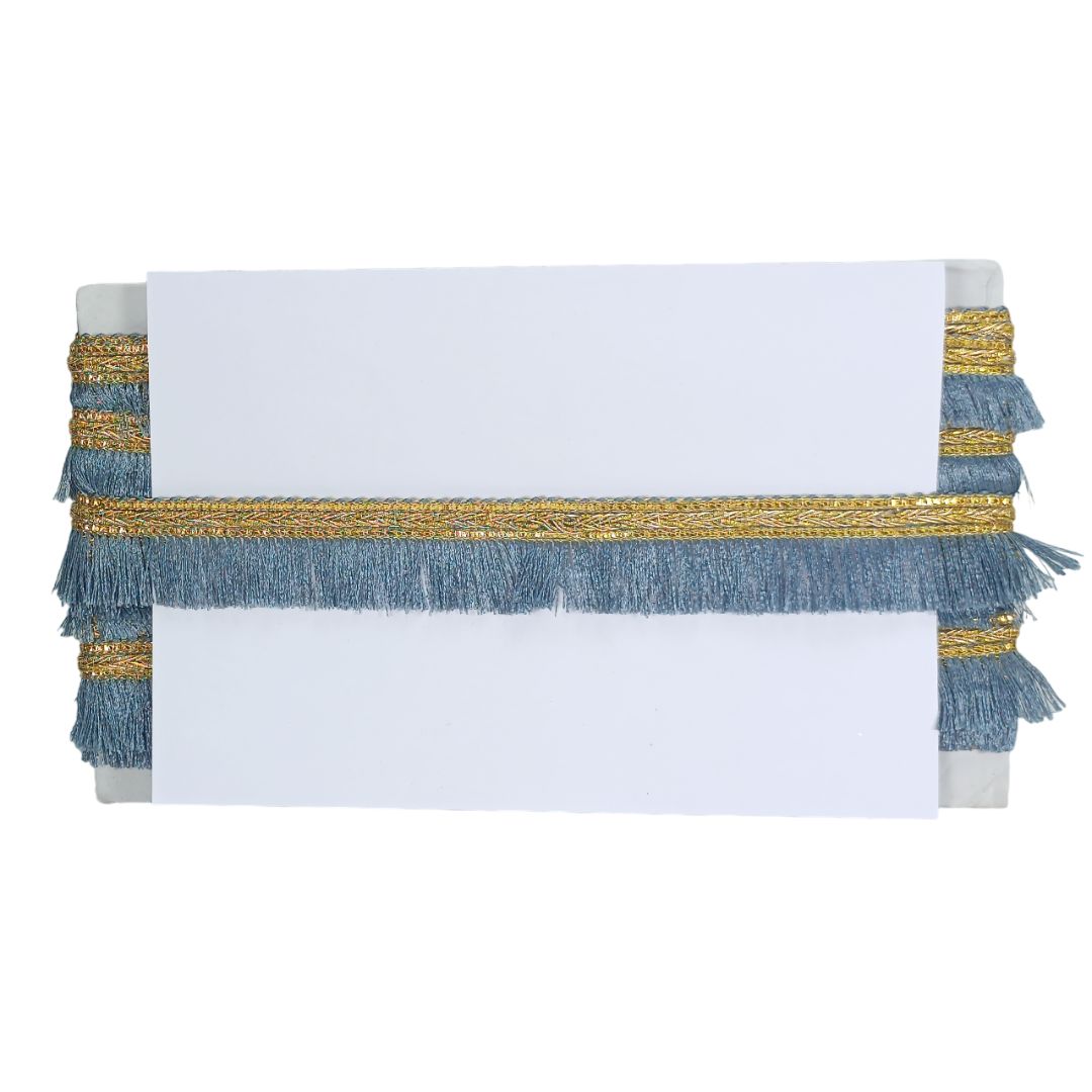 Decorative table runner with blue and gold fringe on a white background