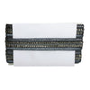 White clutch with black and gold embellishments on a white background