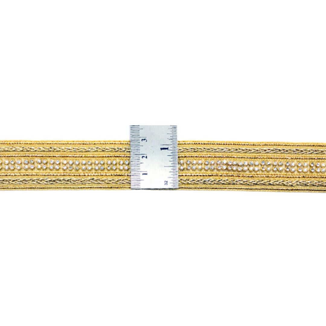 Gold and silver braided cord with a ruler for scale on a white background