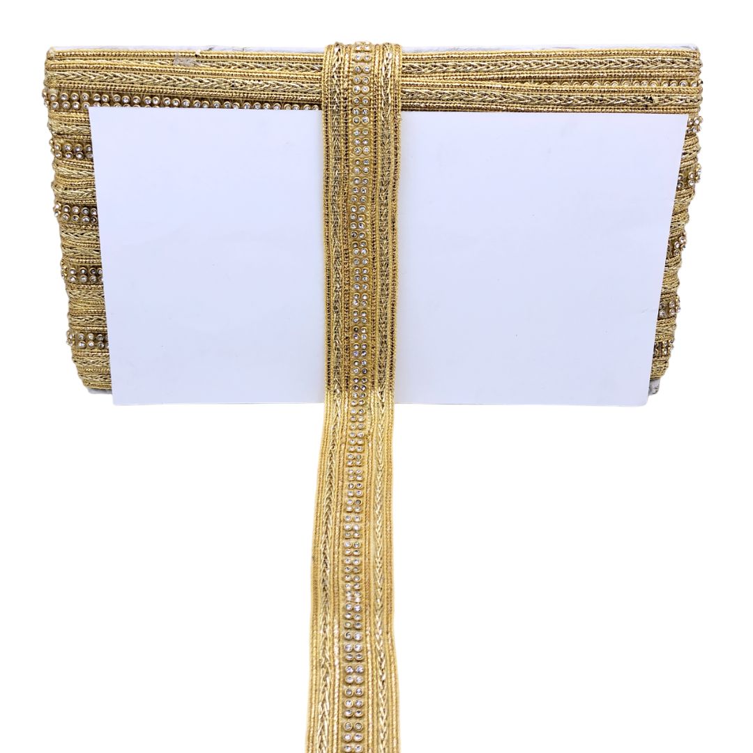 Gold clutch with a white card inside on a white background