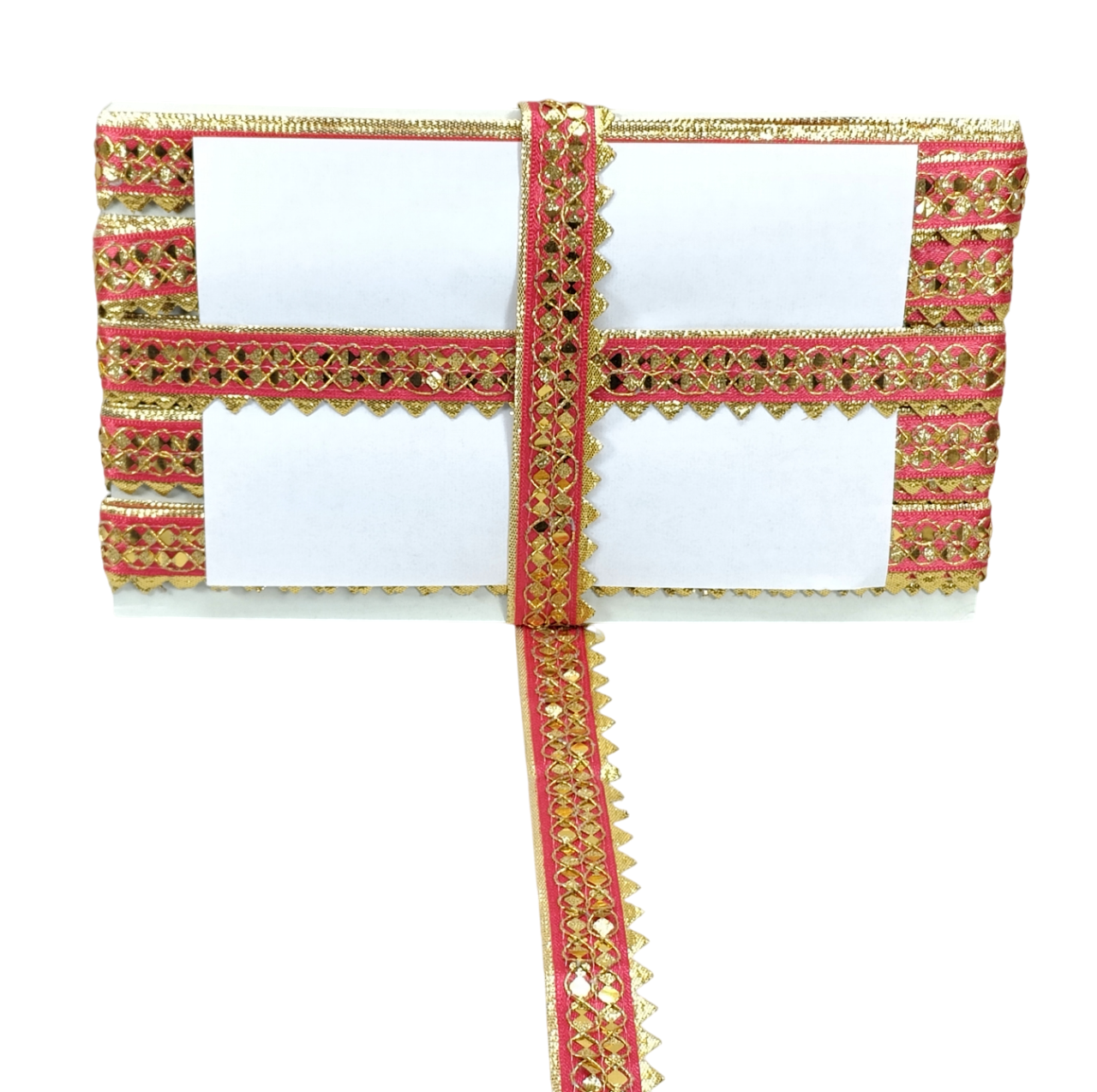 Decorative red and gold ribbon with a white card on a white background