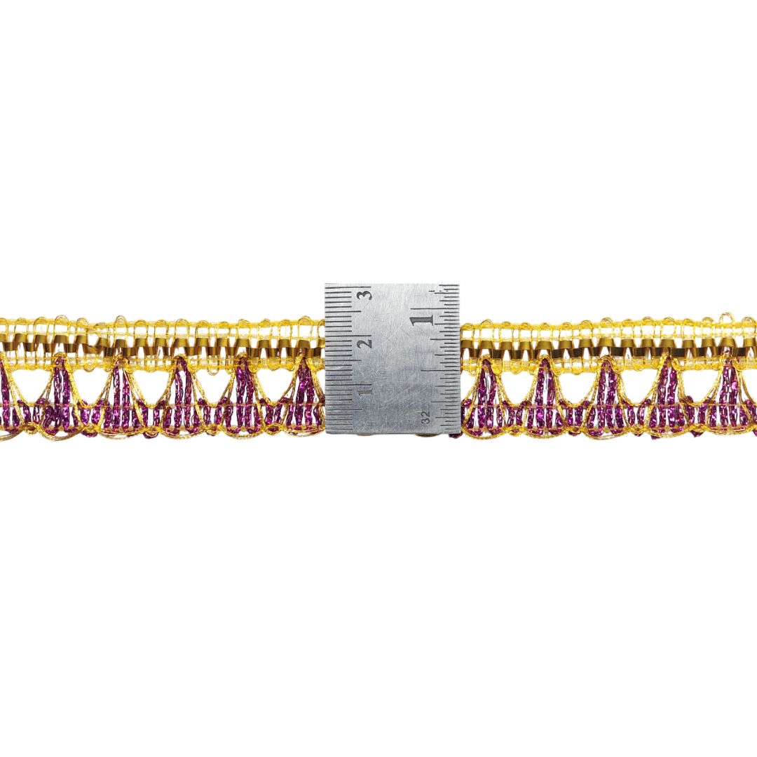 Gold and purple decorative trim with a ruler for scale on a white background