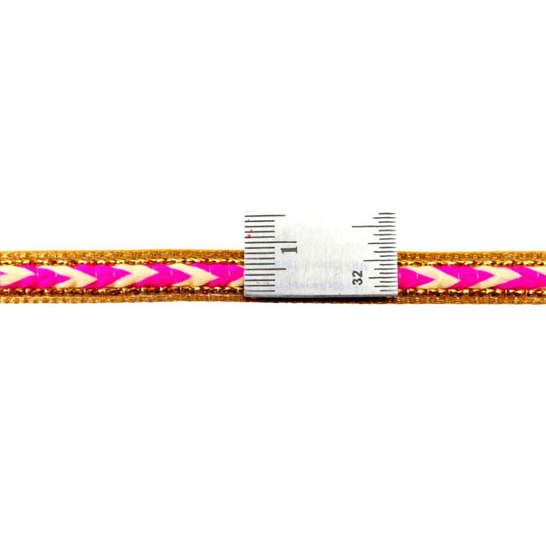 Ruler with pink and gold pattern on a white background