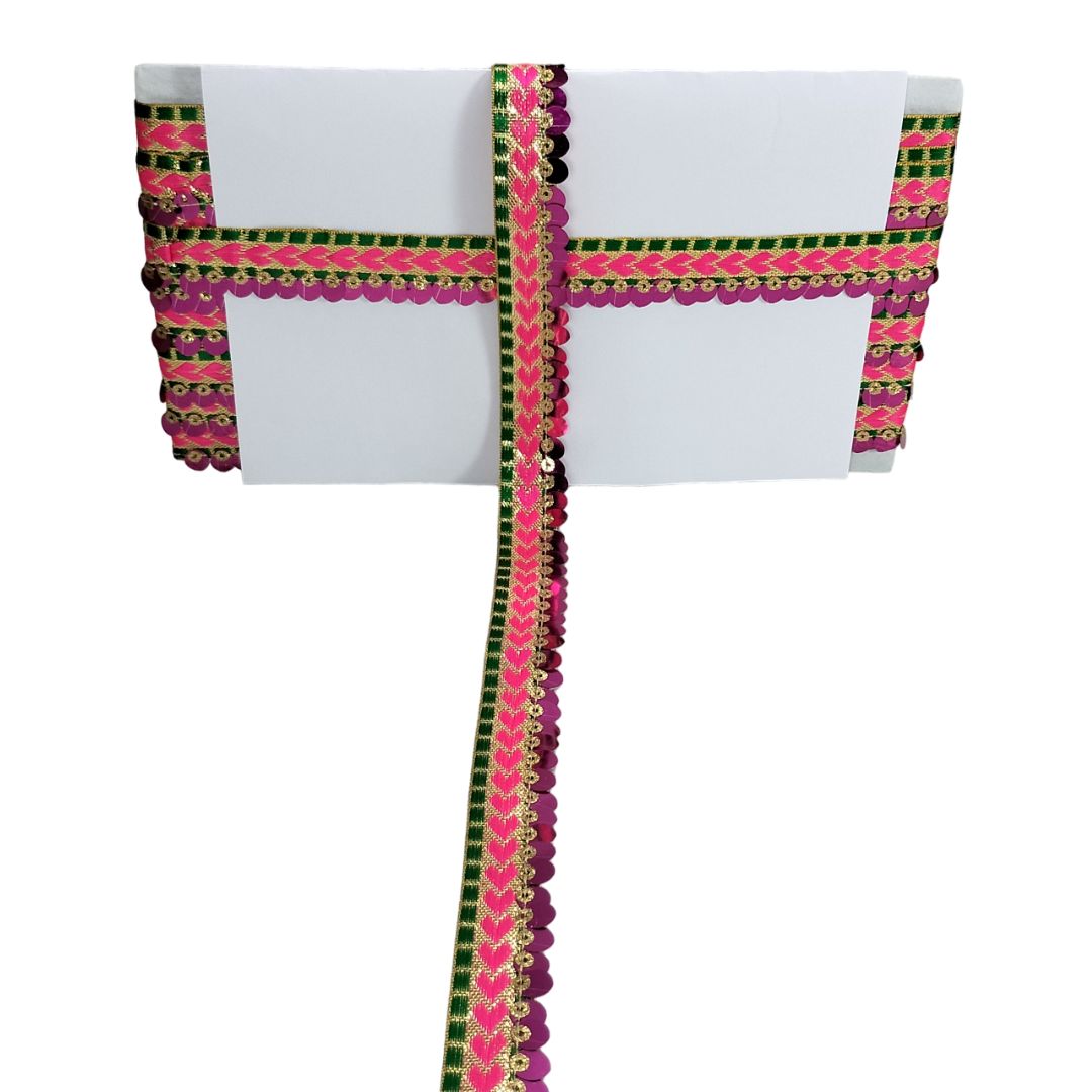 White saree with pink and green border on a white background