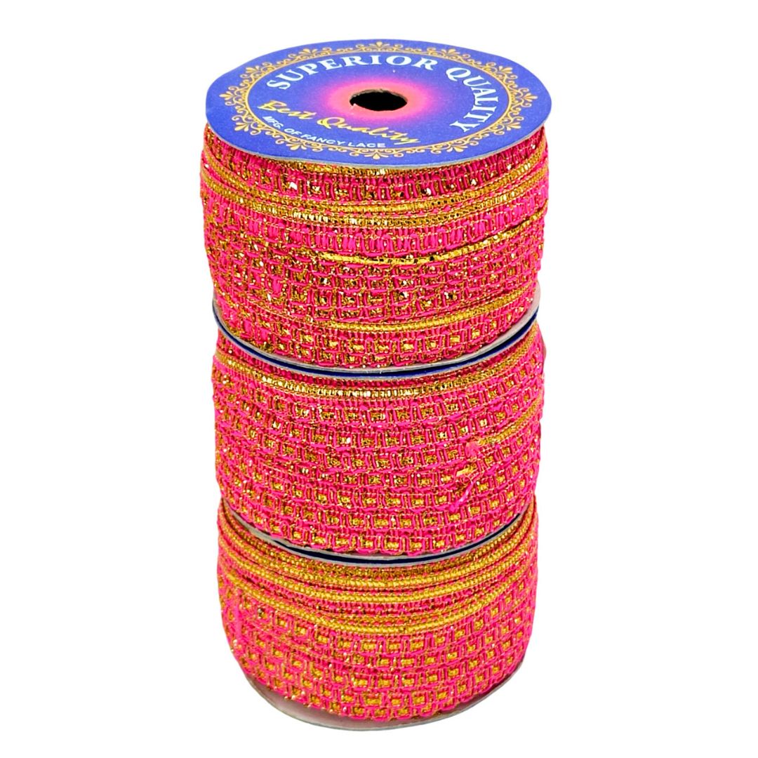Spool of pink and gold thread with 'Superior Quality' label on a white background