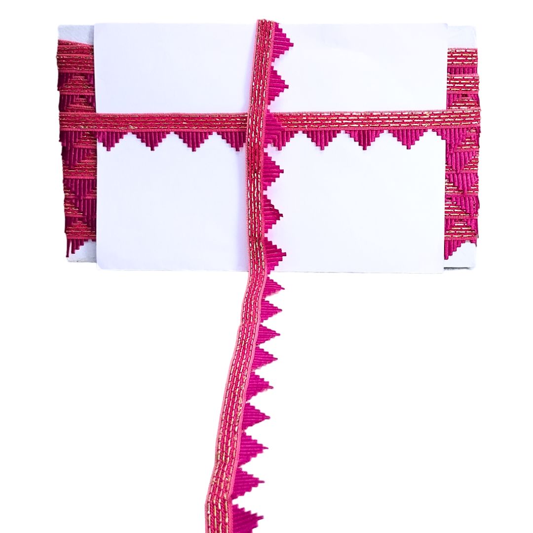 White fabric with pink decorative border on a white background