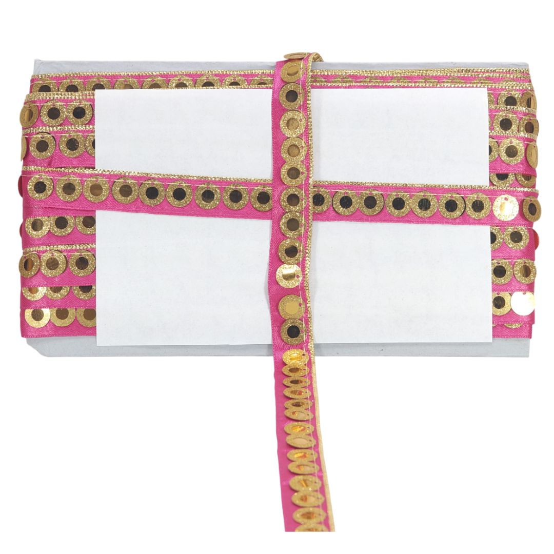 White clutch with pink and gold decorative band on a white background